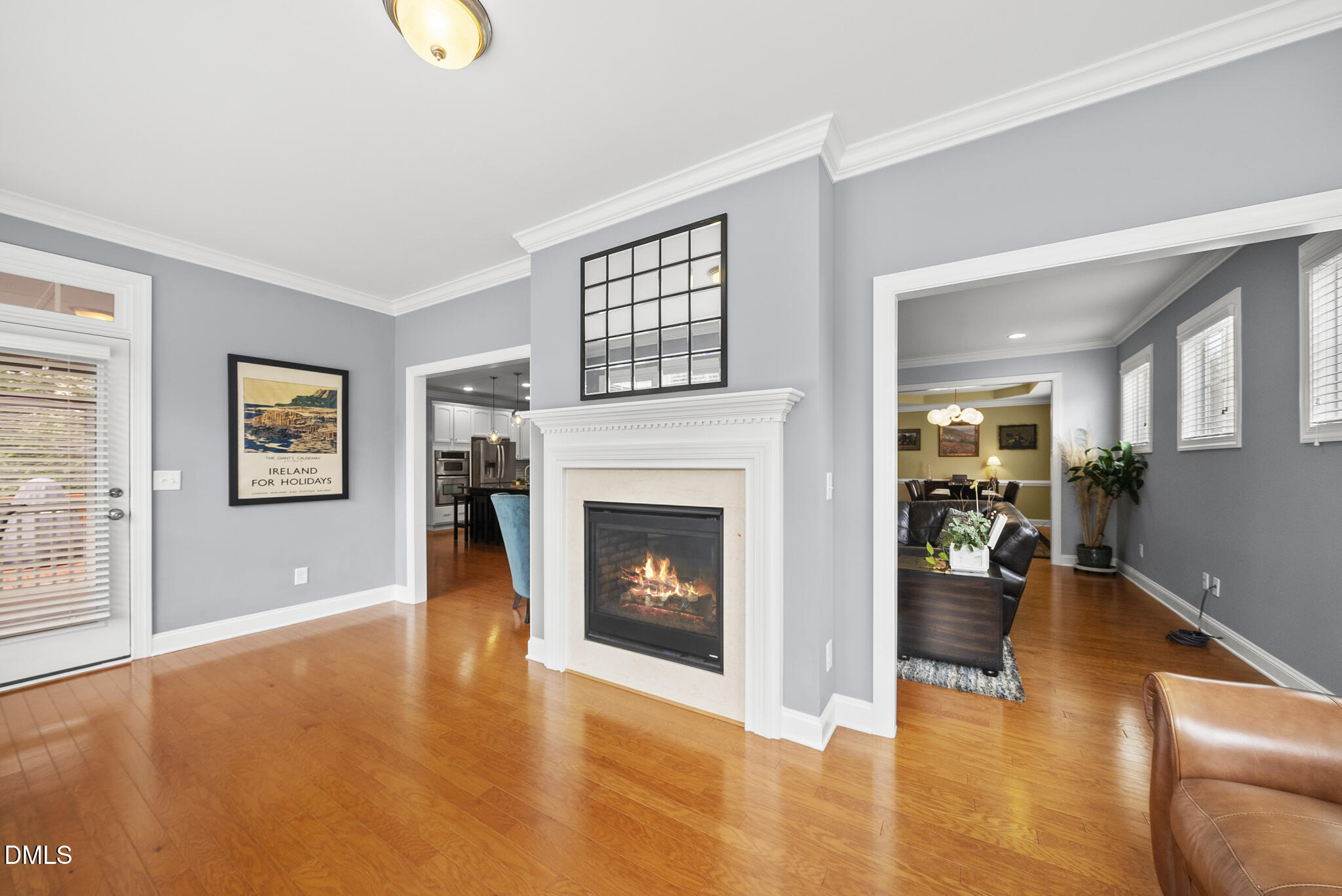 424 Powers Ferry Road Cary, NC 27519 - Photo 29 of 88 a living room with furniture and a fireplace