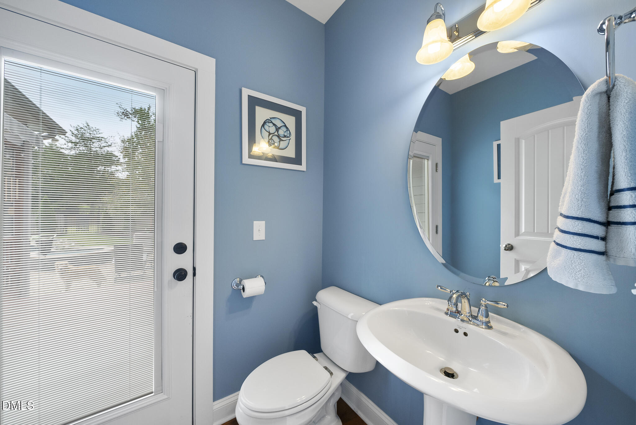 424 Powers Ferry Road Cary, NC 27519 - Photo 31 of 88 a bathroom with a toilet a sink and mirror