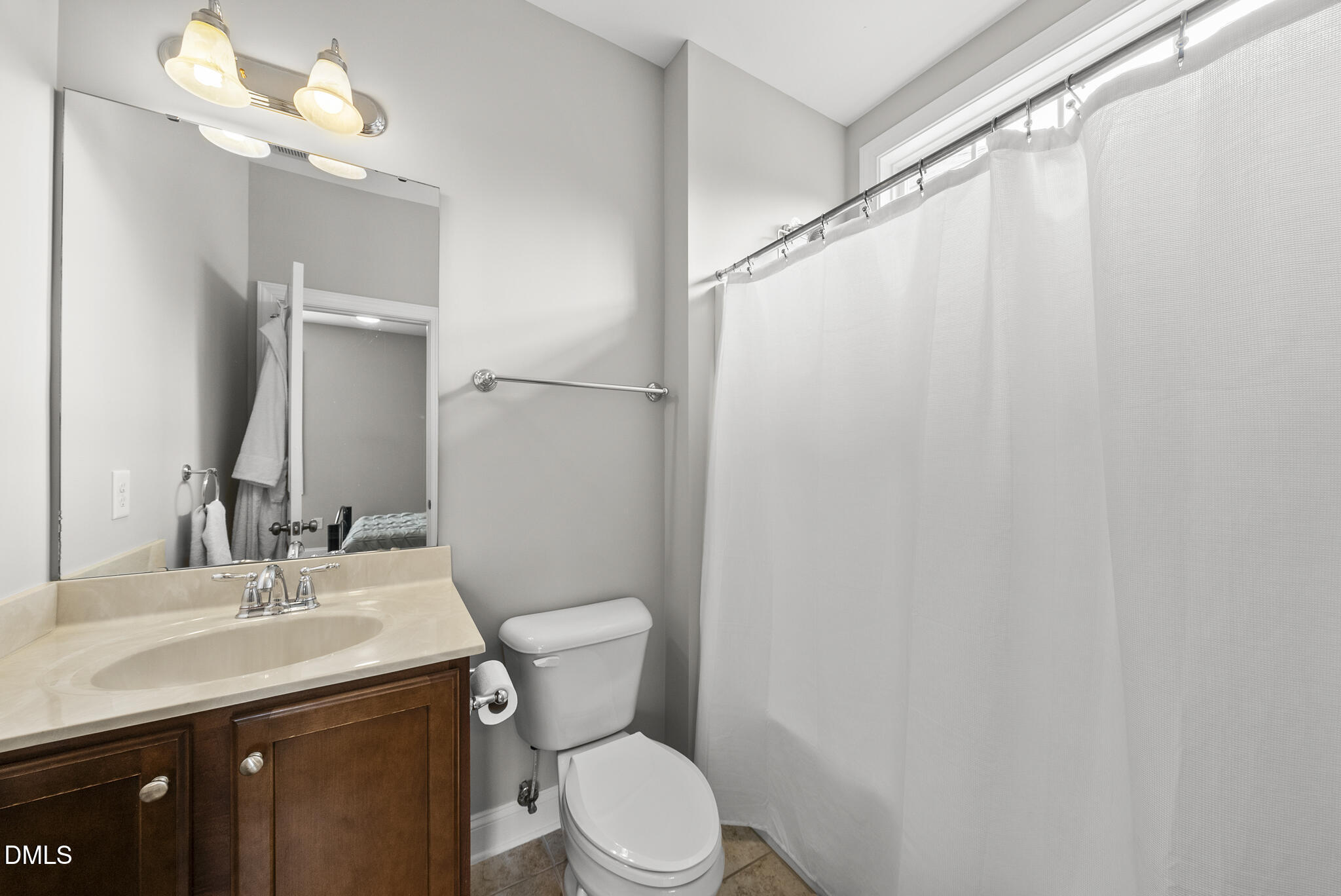 424 Powers Ferry Road Cary, NC 27519 - Photo 36 of 88 a bathroom with a sink vanity mirror and toilet