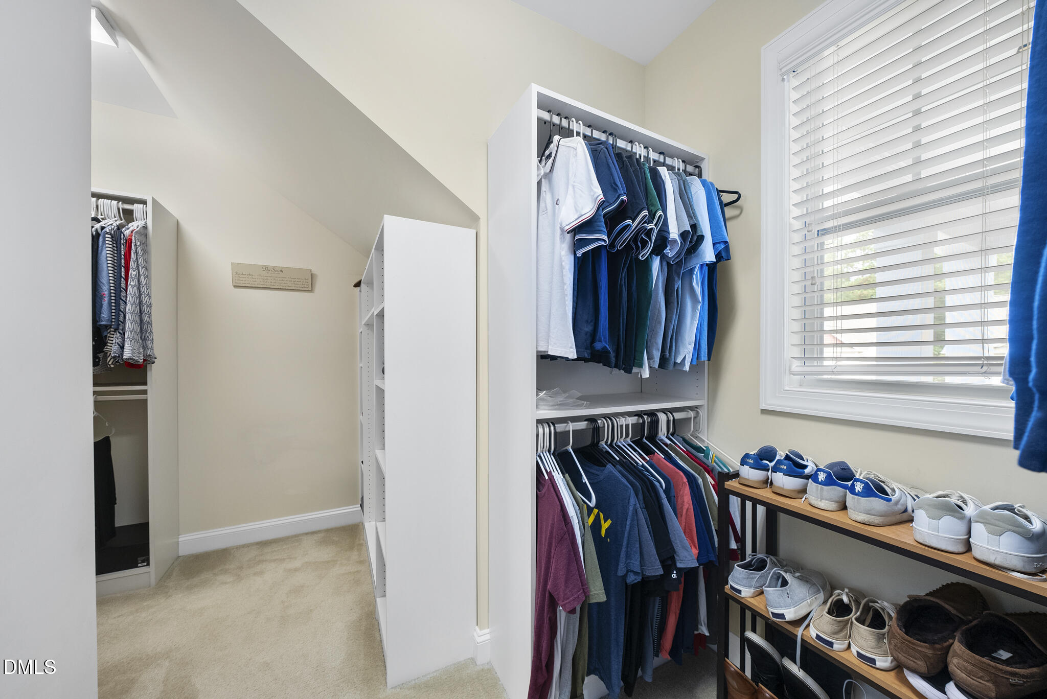 424 Powers Ferry Road Cary, NC 27519 - Photo 44 of 88 a view of walk in closet with clothes and shoes
