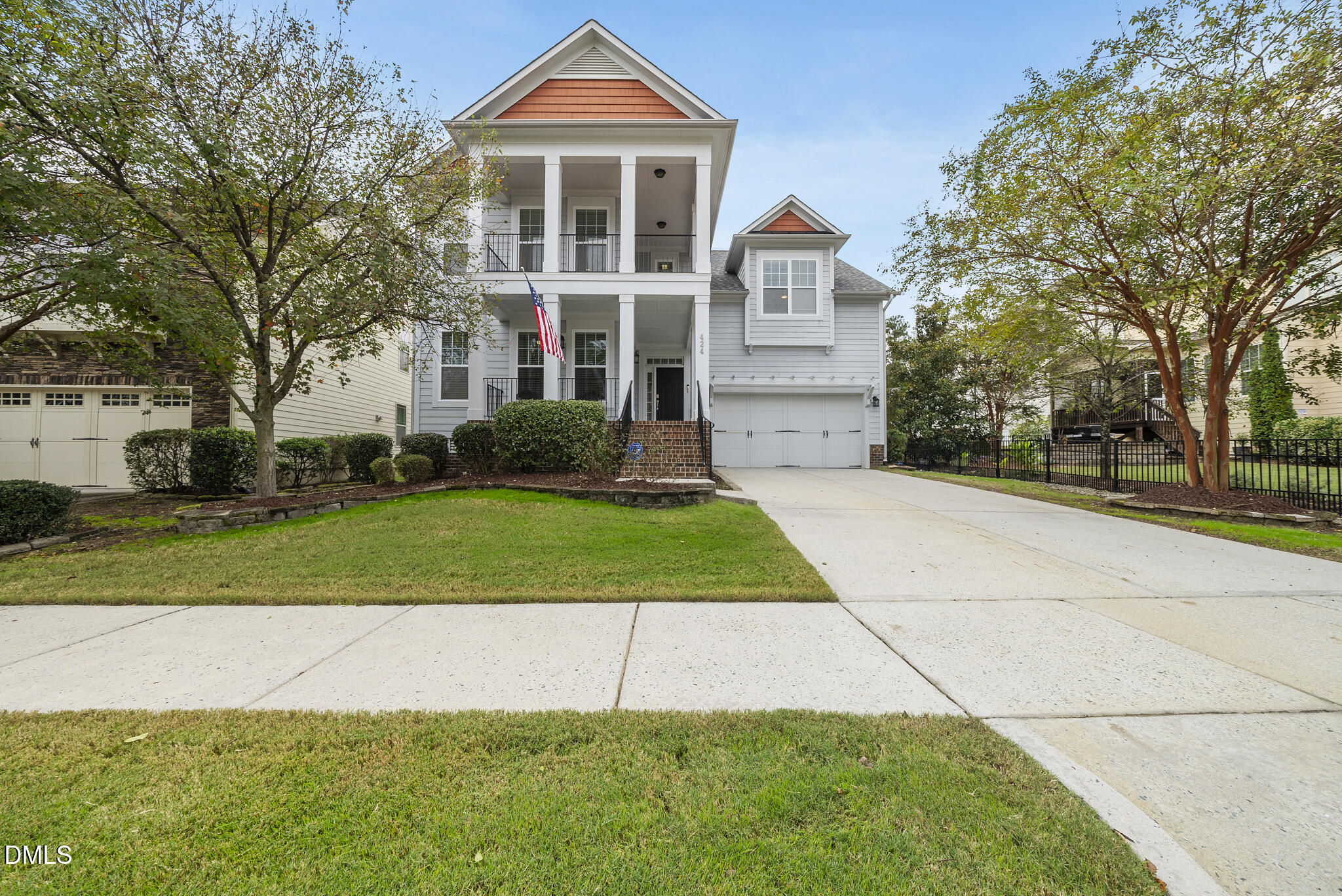 424 Powers Ferry Road Cary, NC 27519 - Photo 3 of 88 a front view of a house with a yard and trees