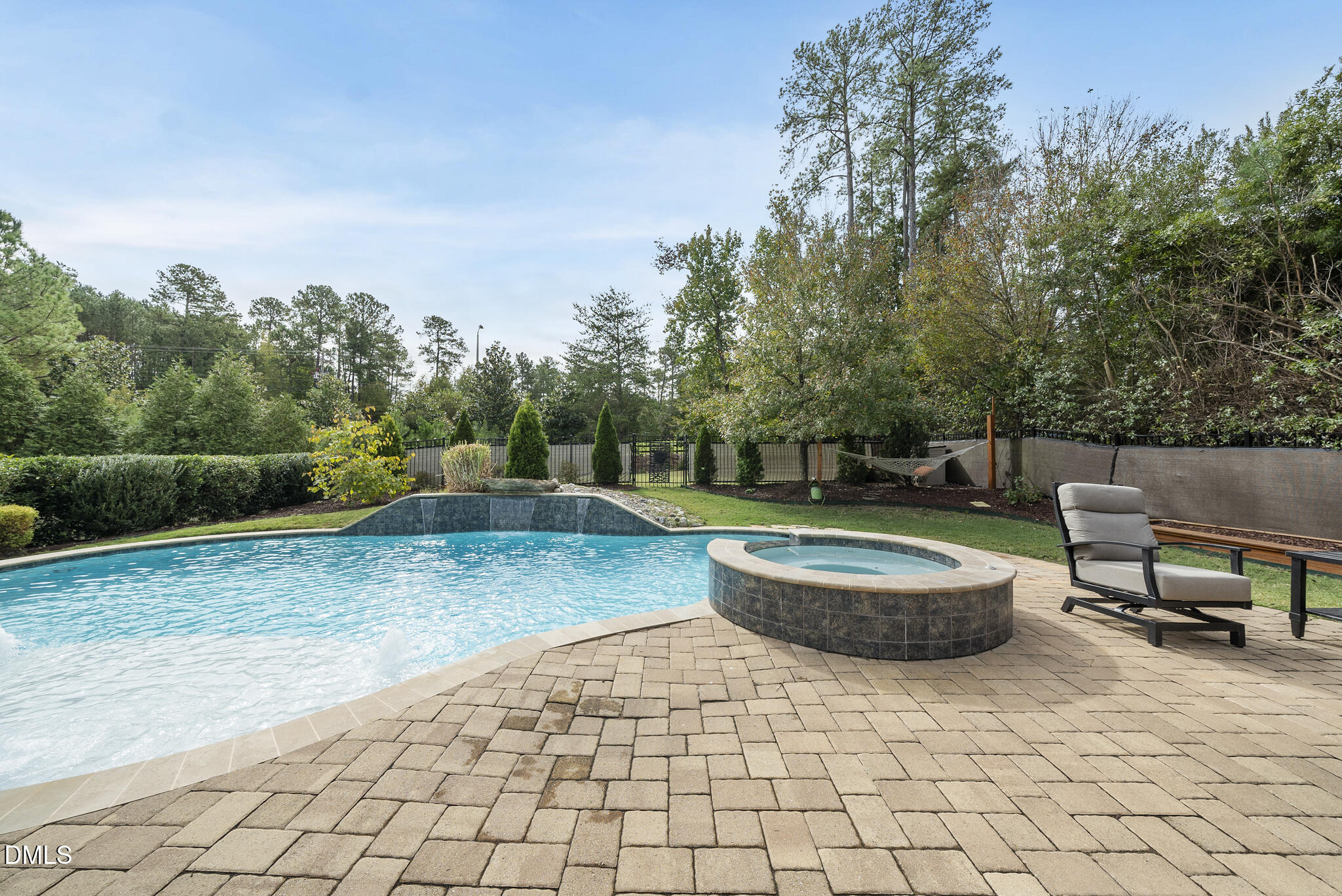 424 Powers Ferry Road Cary, NC 27519 - Photo 59 of 88 a backyard of a house with fountain table and chairs