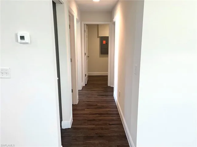 a view of a hallway with the wooden floor