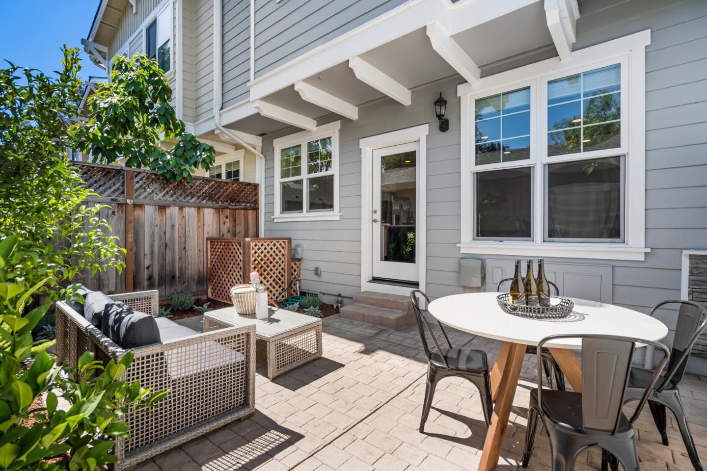 650 Willowgate Street Mountain View, CA 94043 - Photo 15 of 33 a view of a patio with table and chairs and potted plants