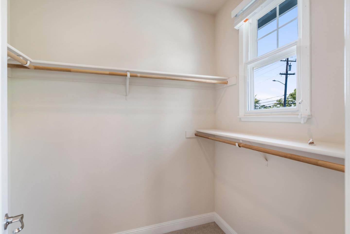 650 Willowgate Street Mountain View, CA 94043 - Photo 21 of 33 a view of a room with rack on the wall and a window