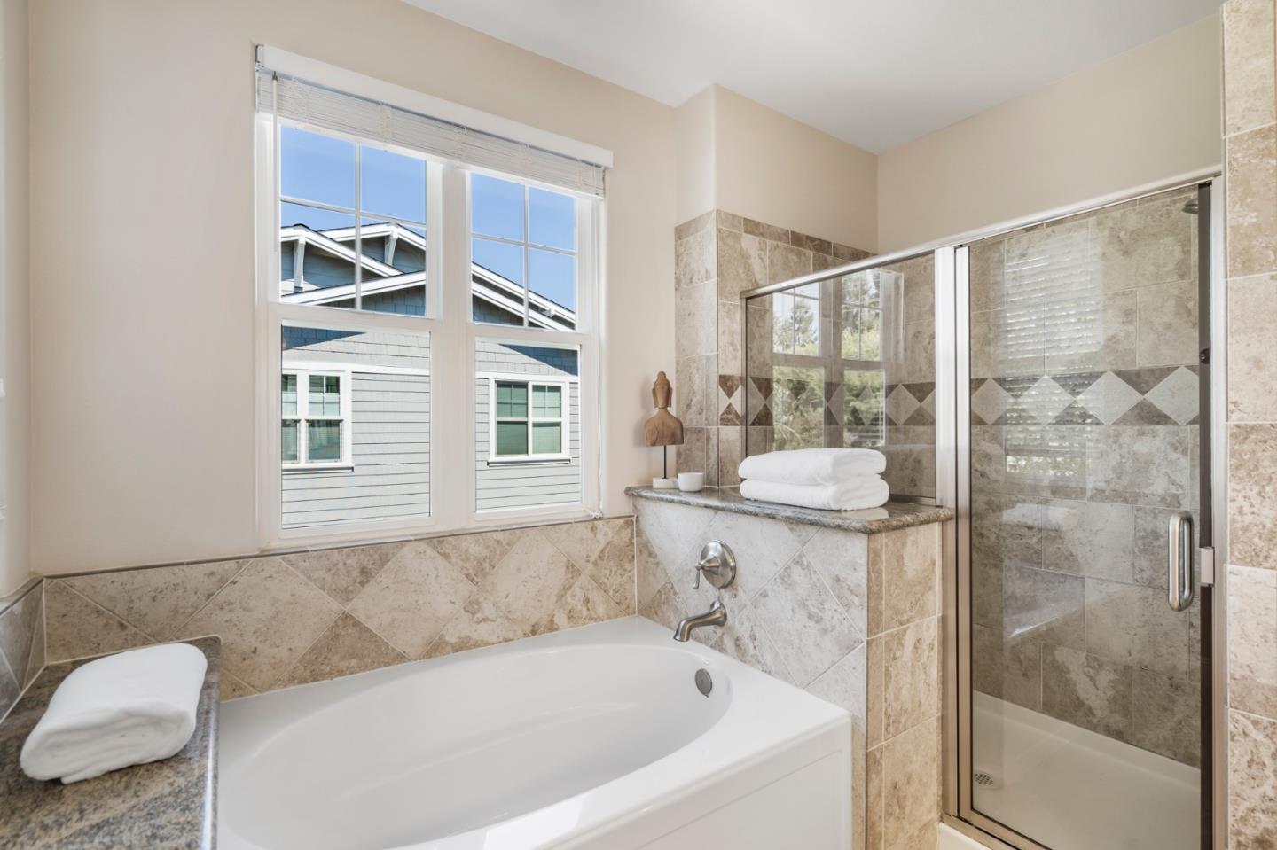 650 Willowgate Street Mountain View, CA 94043 - Photo 23 of 33 a bathroom with a bathtub and a shower