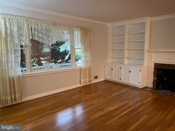 a view of kitchen and dining room with wooden floor
