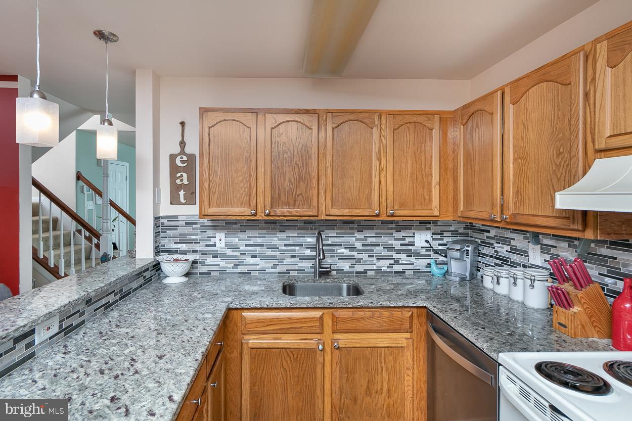 3504 Corn Stream Road Randallstown, MD 21133 - Photo 13 of 34 a kitchen that has a sink and a stove in it