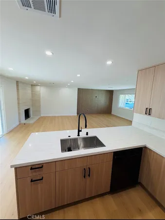 a kitchen with a sink and cabinets