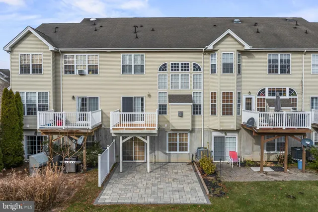 a view of multiple houses with a yard