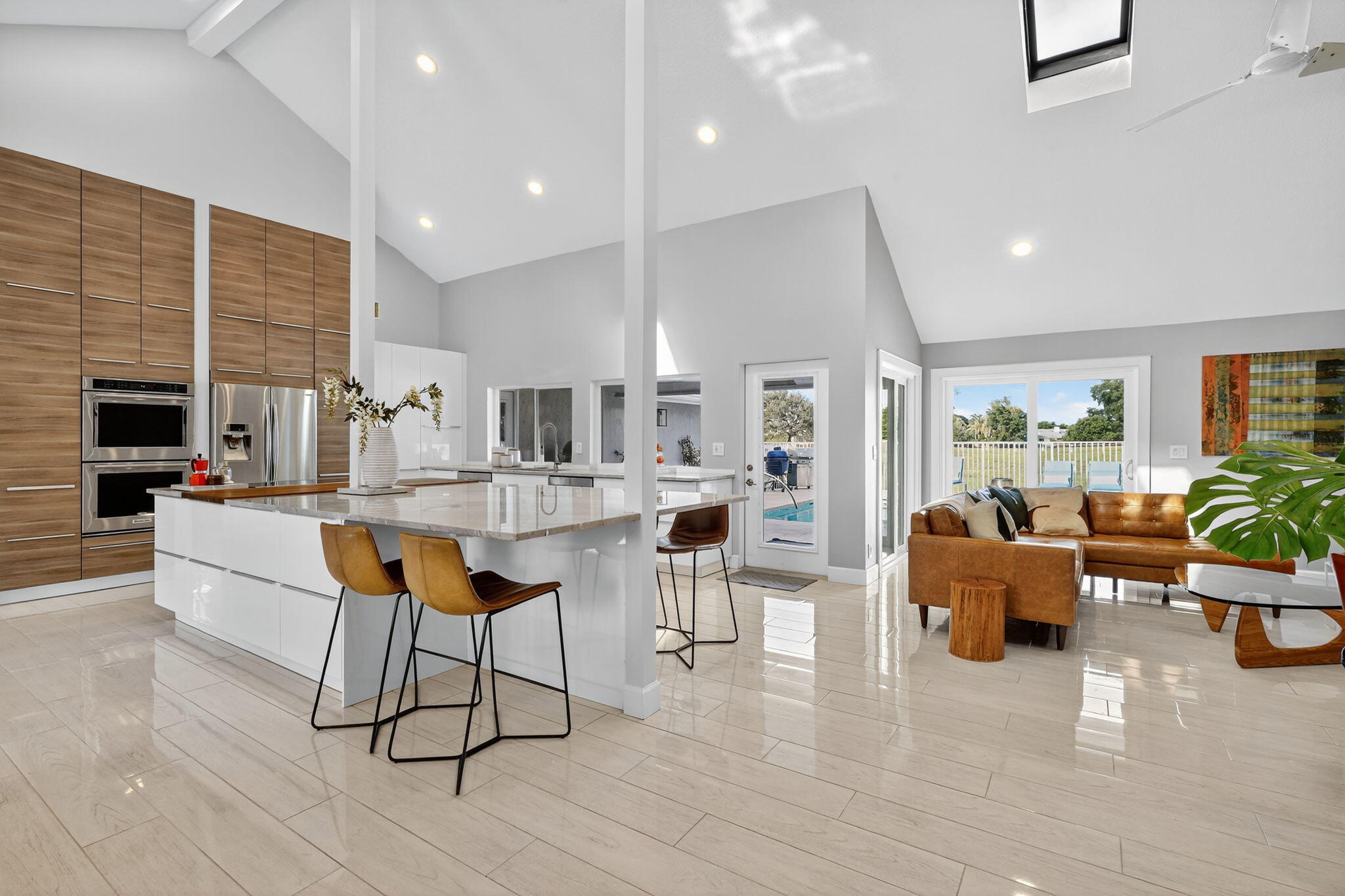 4275 Fox Trace Road Boynton Beach, FL 33436 - Photo 12 of 69 a living room with furniture a dining table and kitchen view