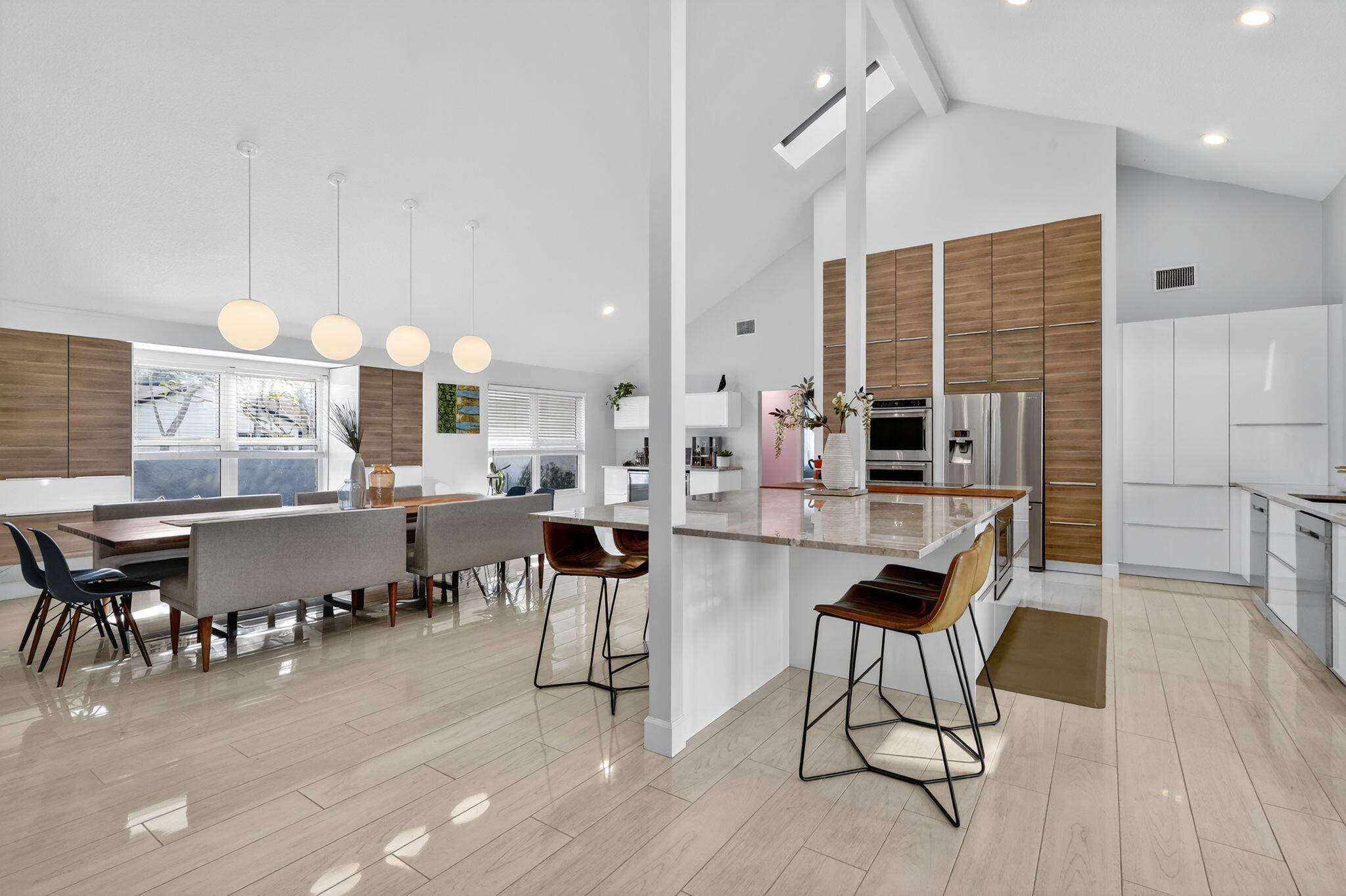 4275 Fox Trace Road Boynton Beach, FL 33436 - Photo 16 of 69 a large kitchen with a table and chairs