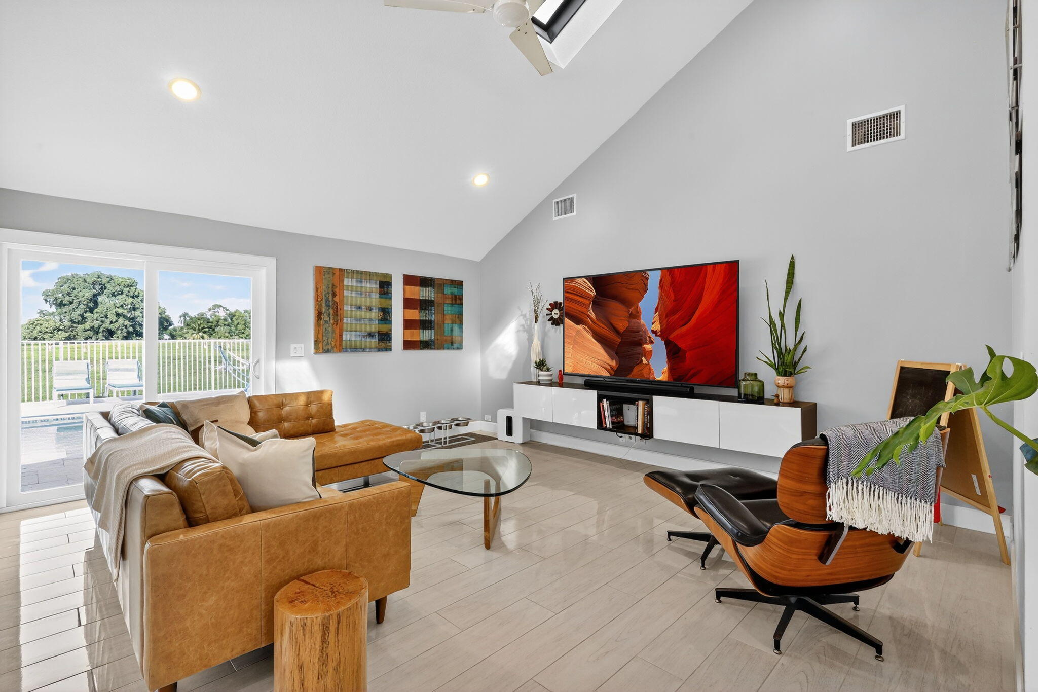 4275 Fox Trace Road Boynton Beach, FL 33436 - Photo 20 of 69 a living room with furniture and a flat screen tv