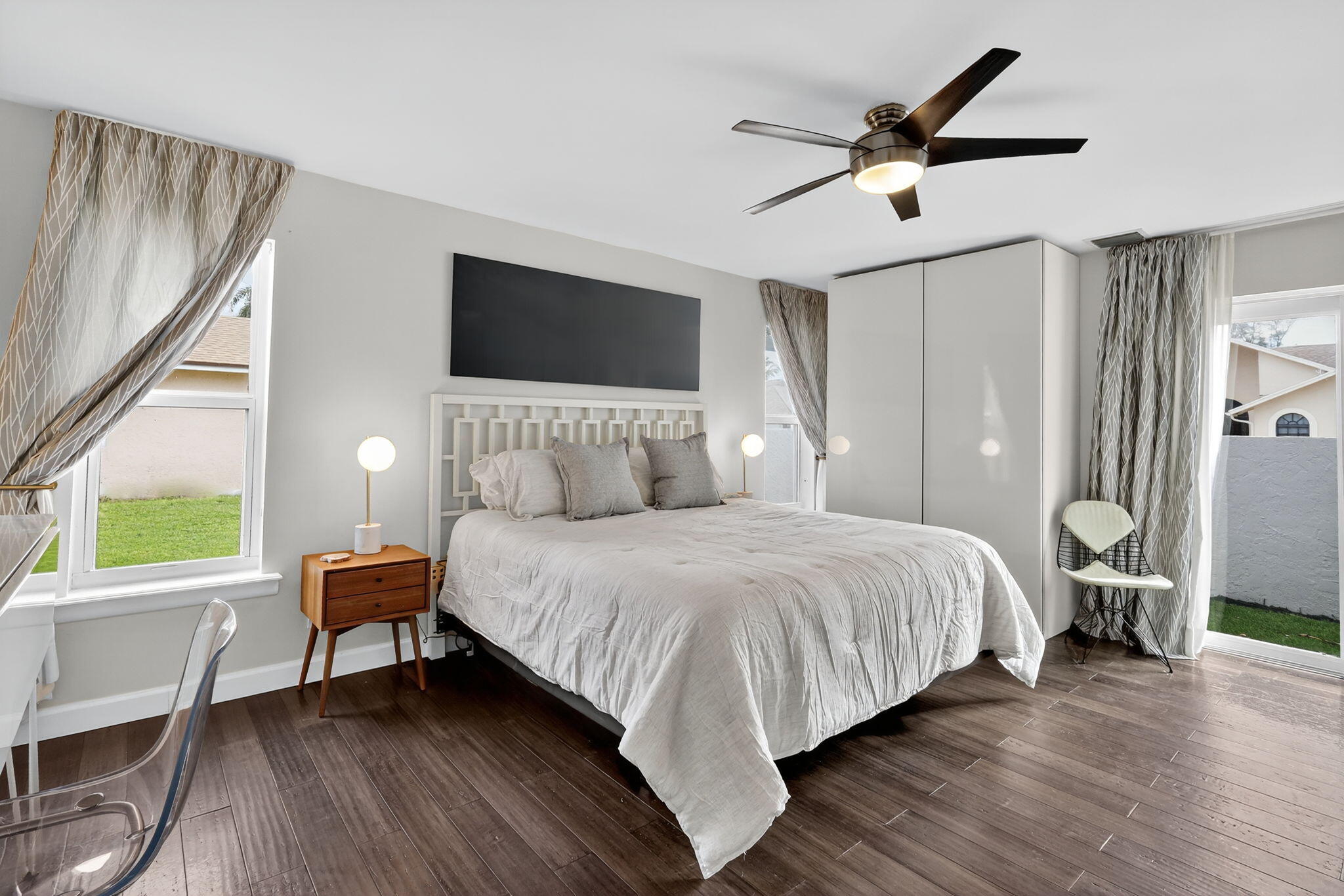 4275 Fox Trace Road Boynton Beach, FL 33436 - Photo 25 of 69 a bedroom with a bed a couch and a window