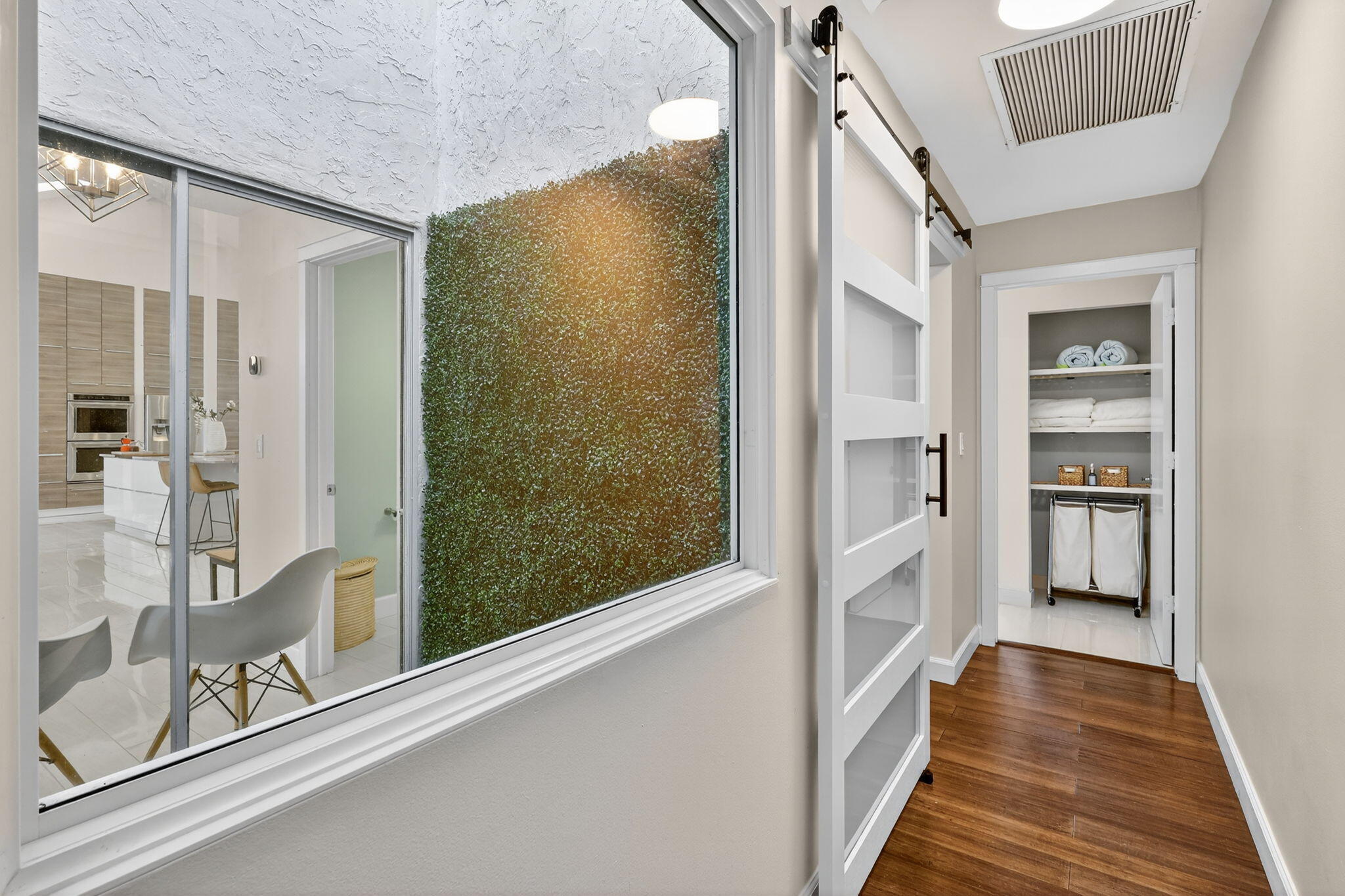 4275 Fox Trace Road Boynton Beach, FL 33436 - Photo 28 of 69 a view of a hallway with wooden floor and staircase