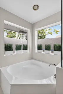 a bathroom with a toilet and a tub