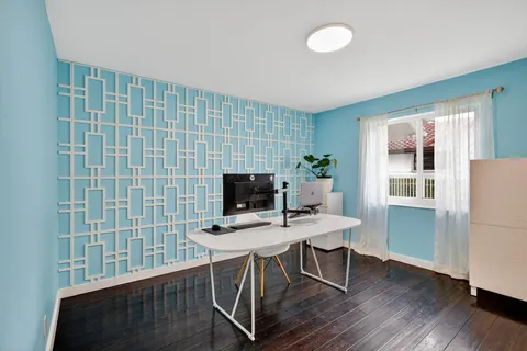 a view of a swimming pool with a lounge chair