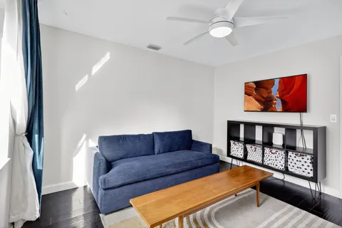 a view of a house with backyard and garden