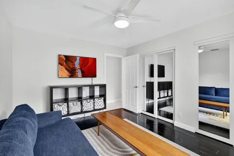 a view of a house with a backyard