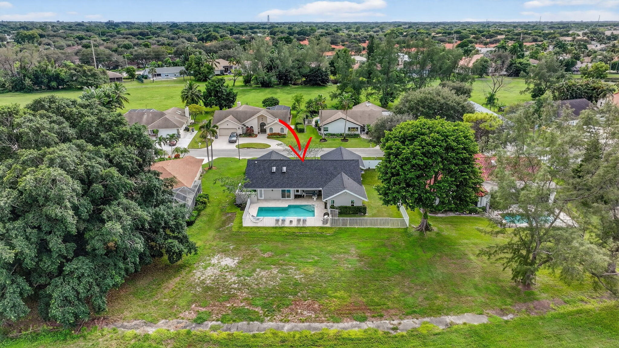 4275 Fox Trace Road Boynton Beach, FL 33436 - Photo 57 of 69 a view of a house with a yard