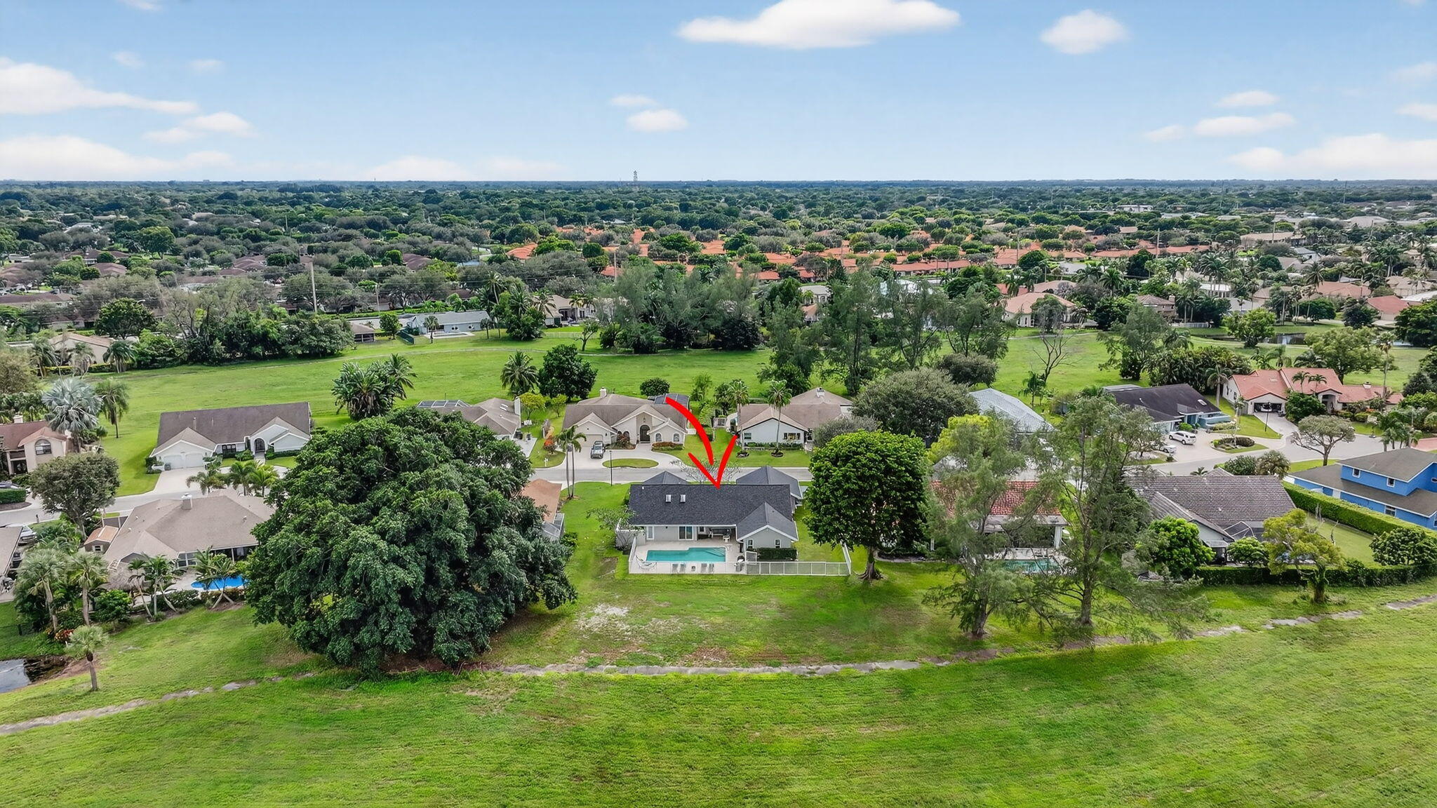 4275 Fox Trace Road Boynton Beach, FL 33436 - Photo 64 of 69 an aerial view of a house with a yard