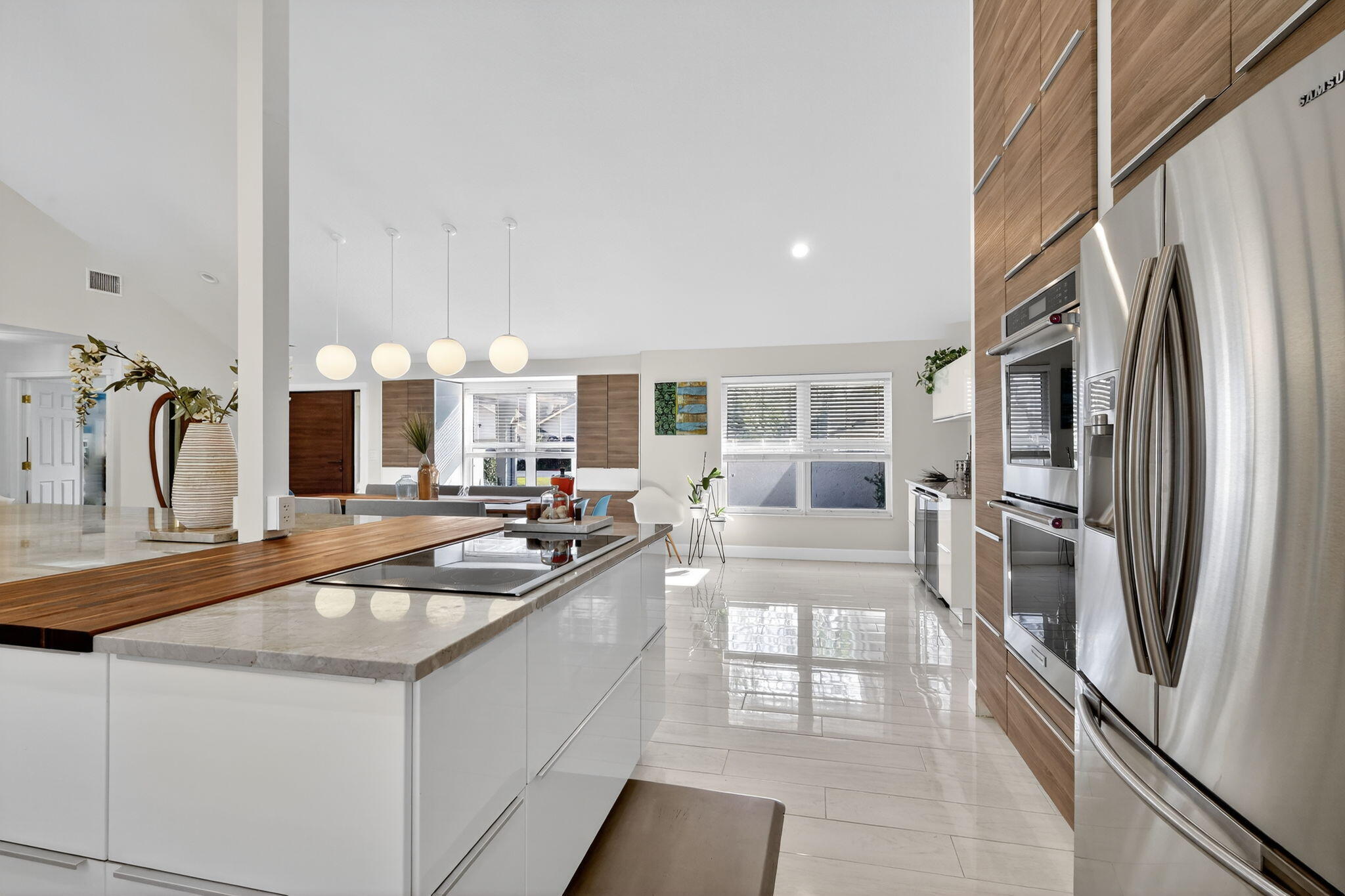 4275 Fox Trace Road Boynton Beach, FL 33436 - Photo 8 of 69 a kitchen with granite countertop a refrigerator and a sink