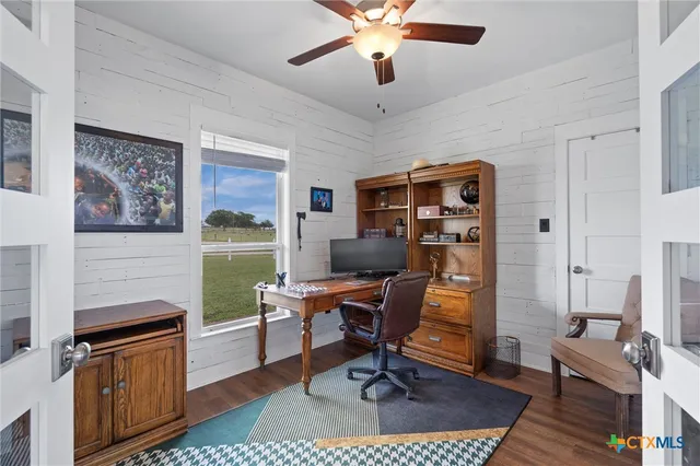 a view of a workspace with furniture and a livingroom