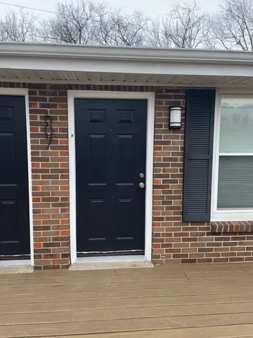 a front view of a building with garage