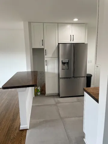 a kitchen with stainless steel appliances a refrigerator and a stove