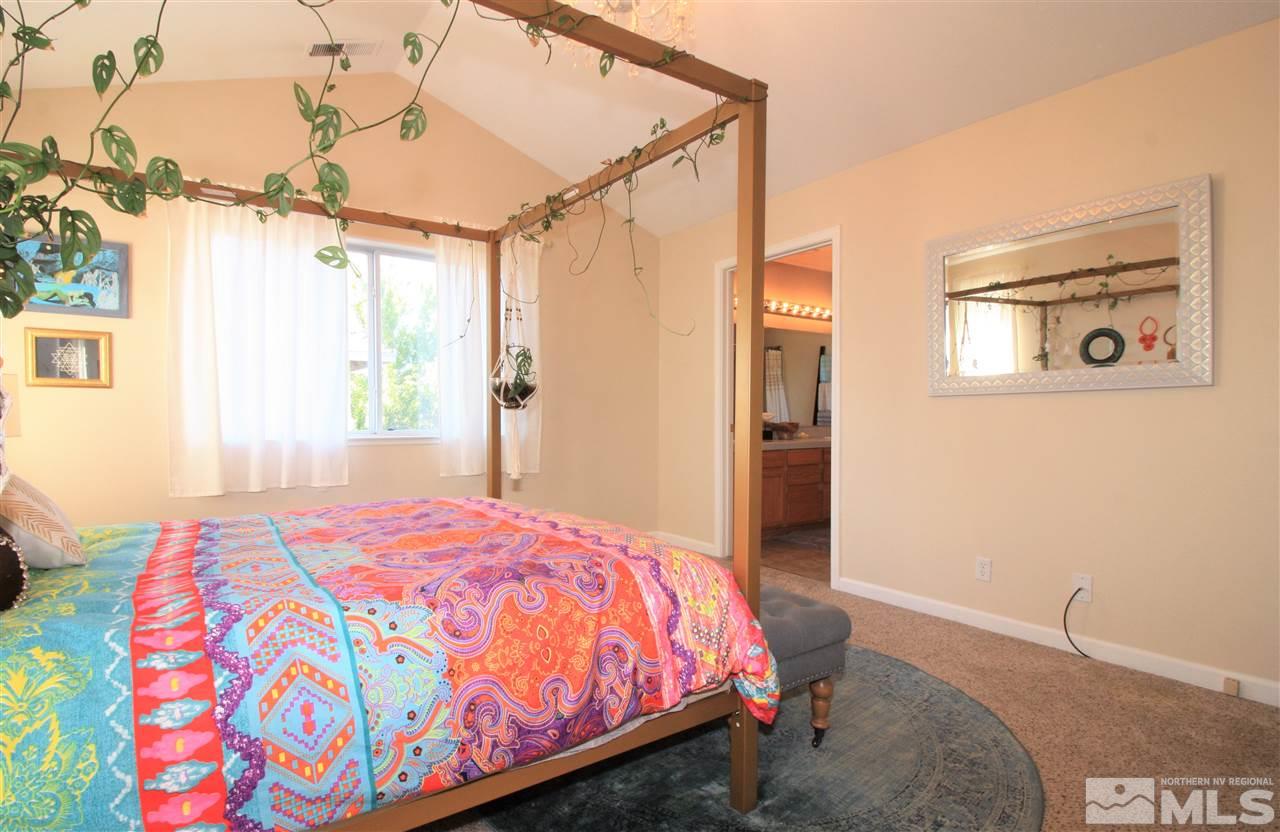 470 Len Circle Reno, NV 89511 - Photo 12 of 24 a bedroom with a bed and a window