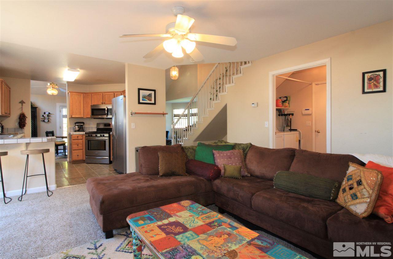470 Len Circle Reno, NV 89511 - Photo 8 of 24 a living room with furniture and a chandelier