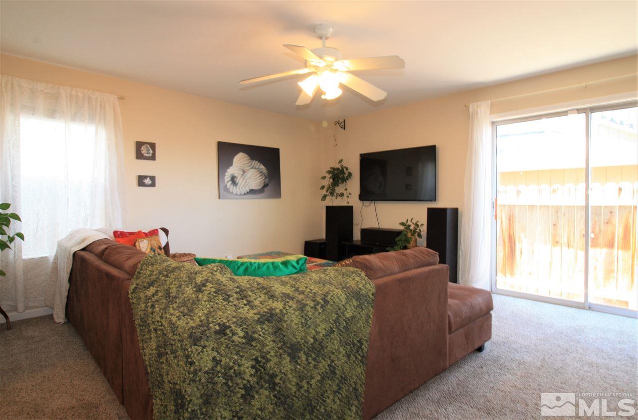 470 Len Circle Reno, NV 89511 - Photo 9 of 24 a living room with furniture and a flat screen tv