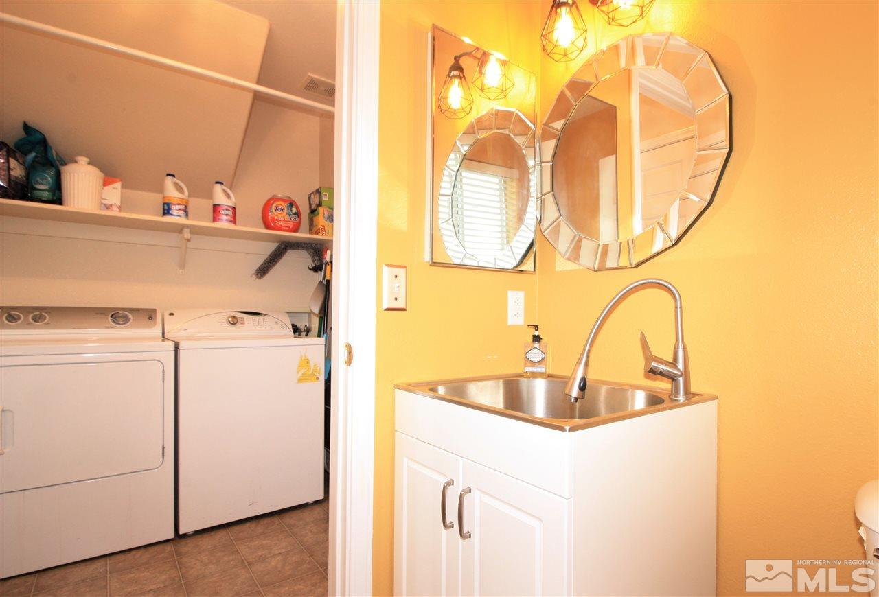 470 Len Circle Reno, NV 89511 - Photo 10 of 24 a utility room with a sink and cabinets