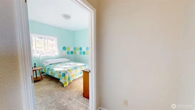 a view of a livingroom with furniture and a flat screen tv