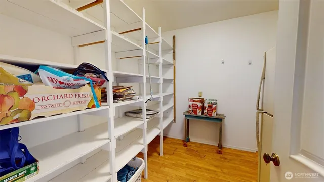 a bathroom with a sink mirror and a toilet