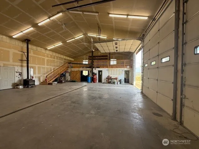 a kitchen with a refrigerator stove and cabinets