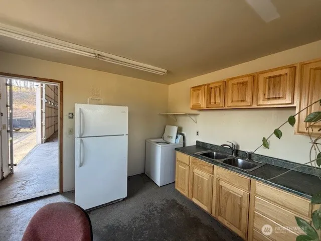 a bathroom with a sink a mirror and shower