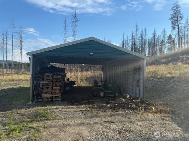 an aerial view of a house swimming pool and outdoor seating