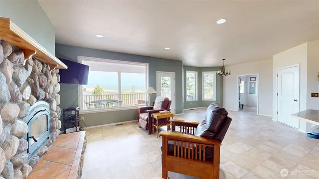 a kitchen with stainless steel appliances granite countertop a refrigerator a stove and a sink