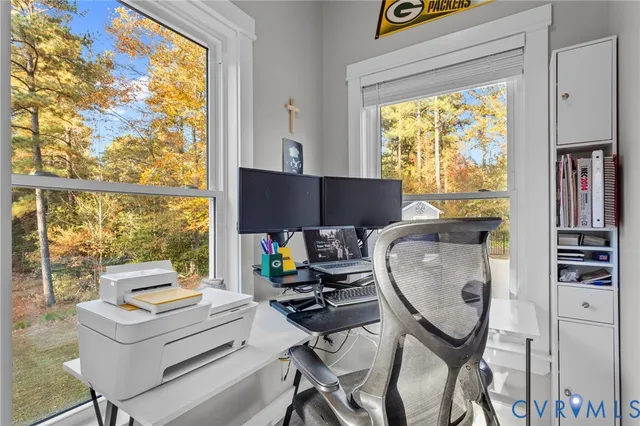 a work room with furniture and a window