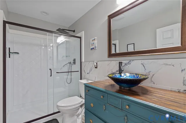 a bathroom with a toilet and a sink