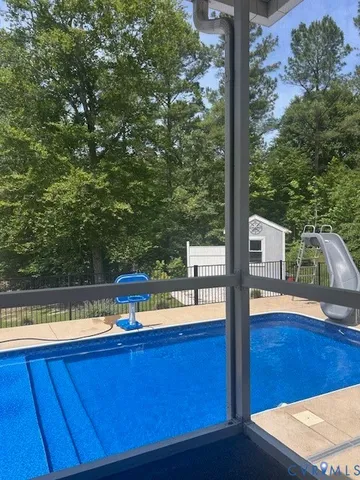 a view of a swimming pool with a patio