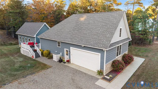 a top view of a house with sitting area and garage
