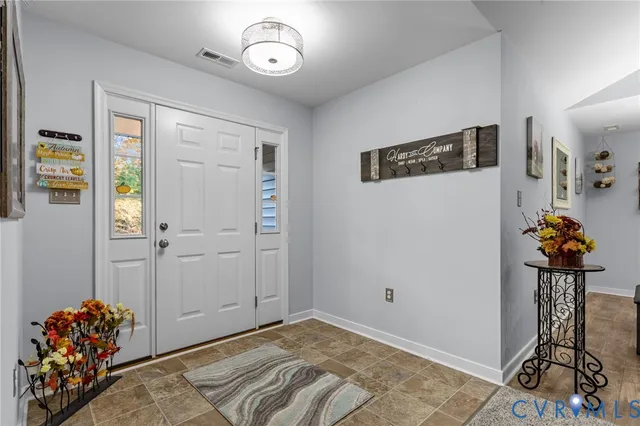 a view of entryway with wooden floor