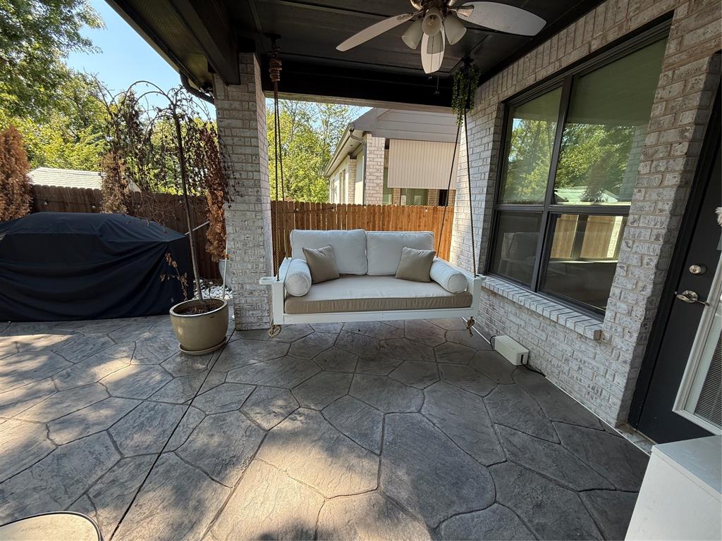 5212 Troupe Road McKinney, TX 75071 - Photo 29 of 38 Covered patio featuring an imprinted concrete surface, brick columns, and a ceiling fan