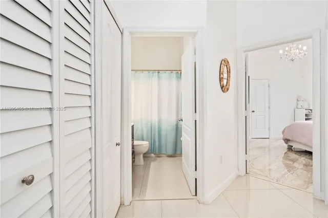 a view of a bathroom from the hallway