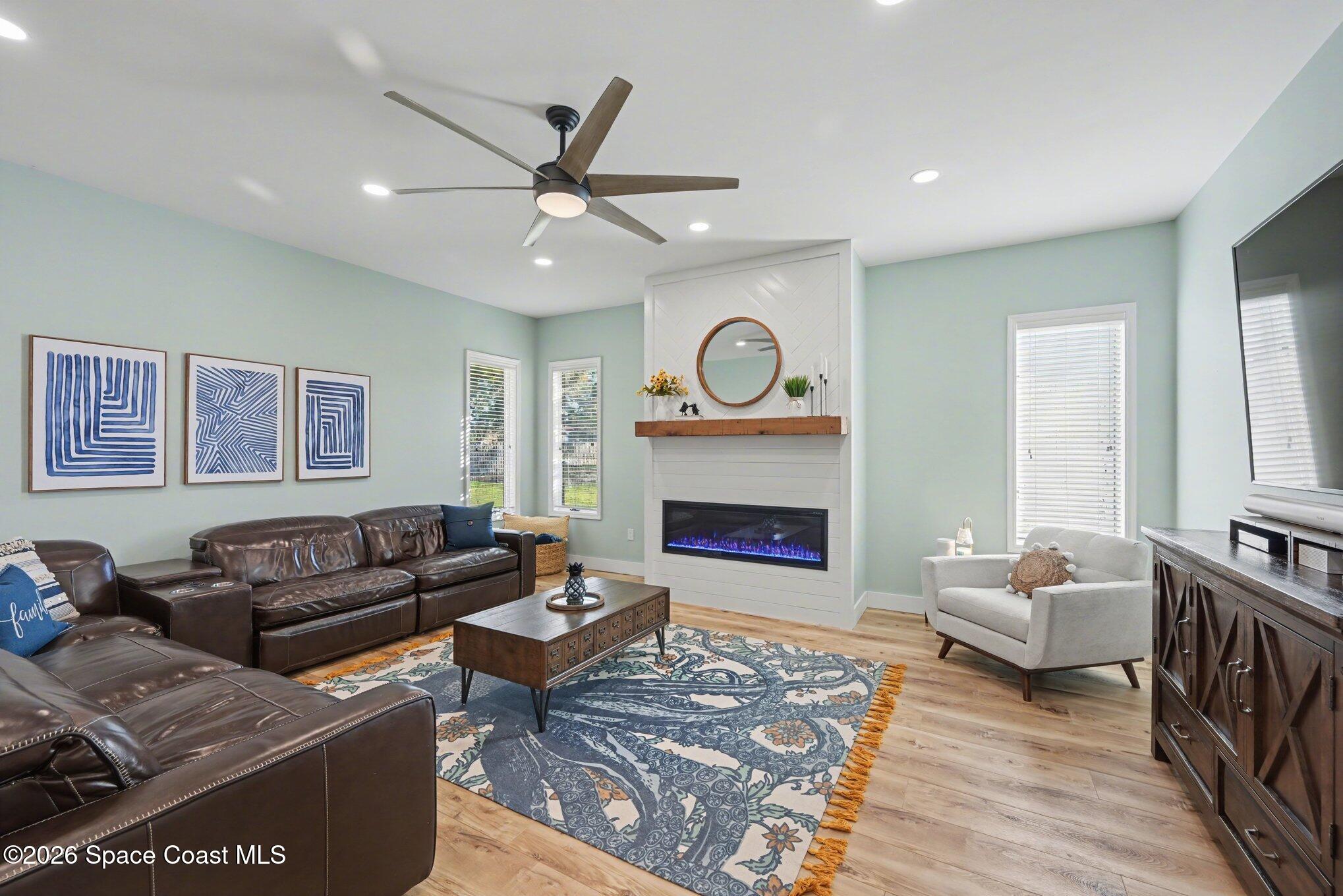 140 Utopia Circle Merritt Island, FL 32952 - Photo 13 of 55 a living room with furniture and a fireplace