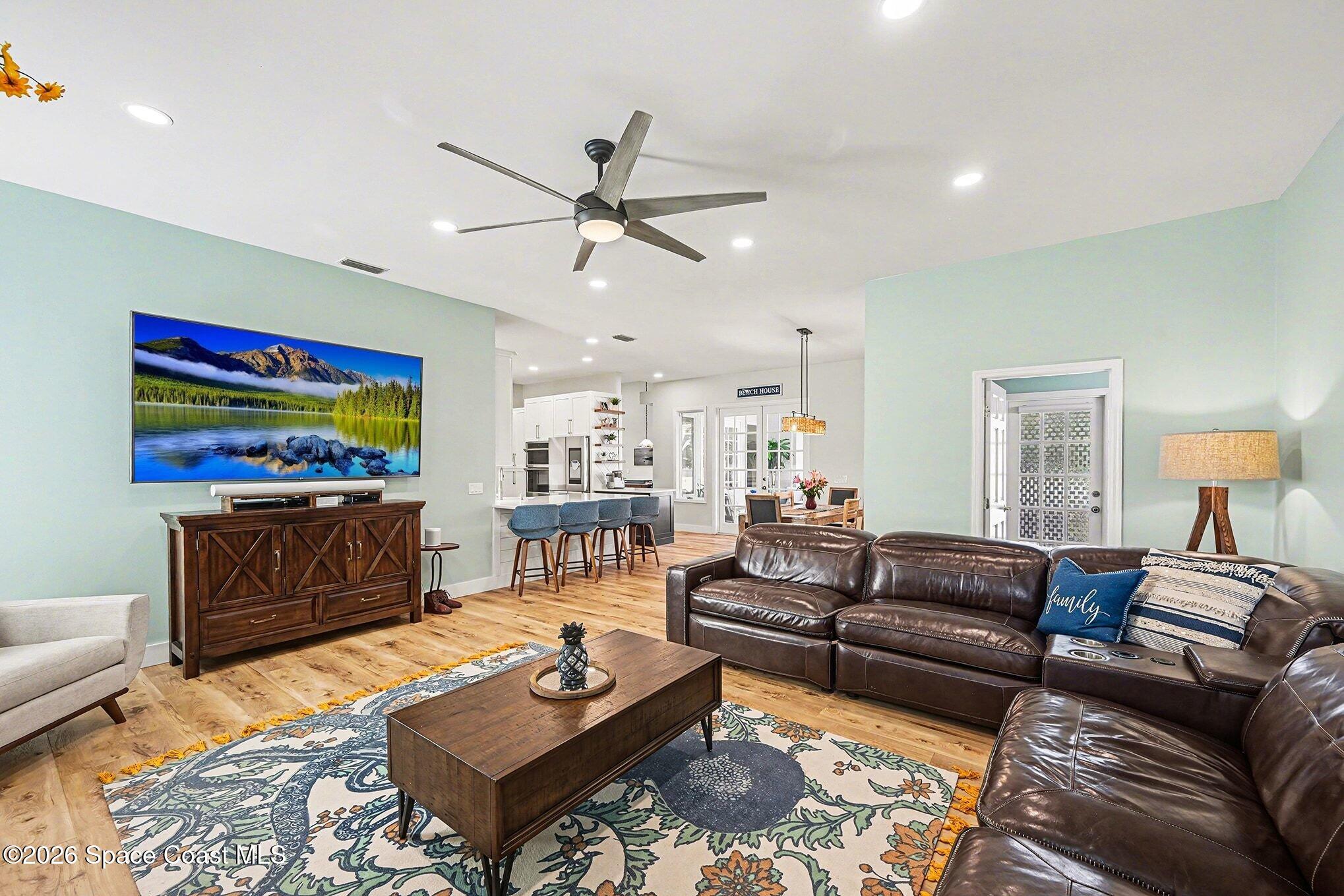 140 Utopia Circle Merritt Island, FL 32952 - Photo 14 of 55 a living room with furniture and a flat screen tv