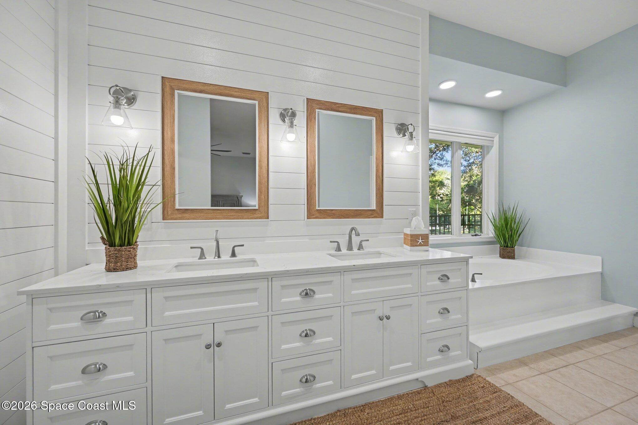 140 Utopia Circle Merritt Island, FL 32952 - Photo 18 of 55 a bathroom with a sink and a mirror