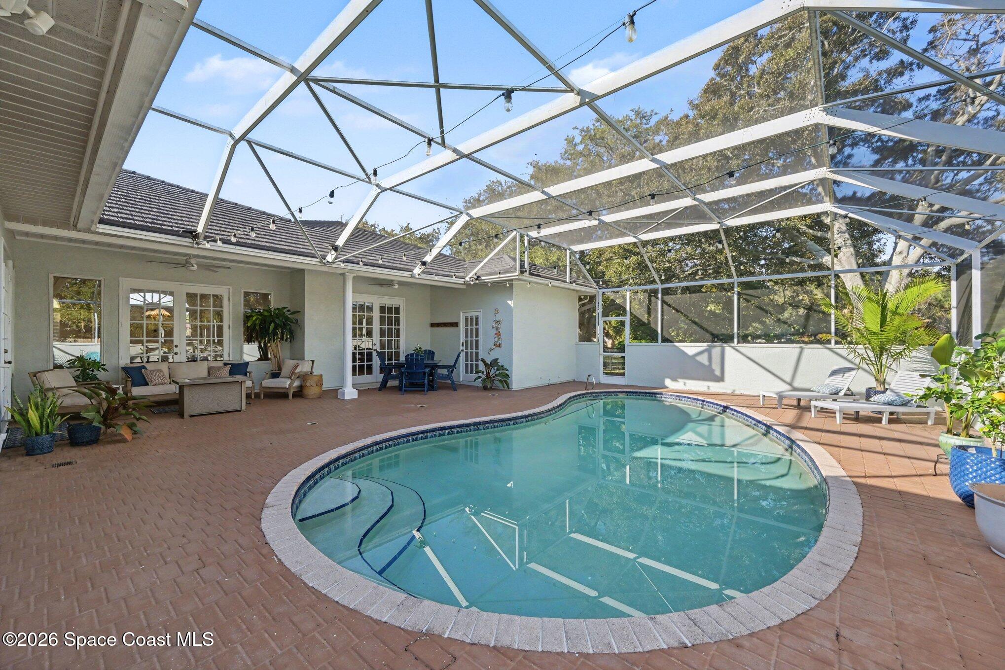 140 Utopia Circle Merritt Island, FL 32952 - Photo 24 of 54 a view of a swimming pool with sitting area